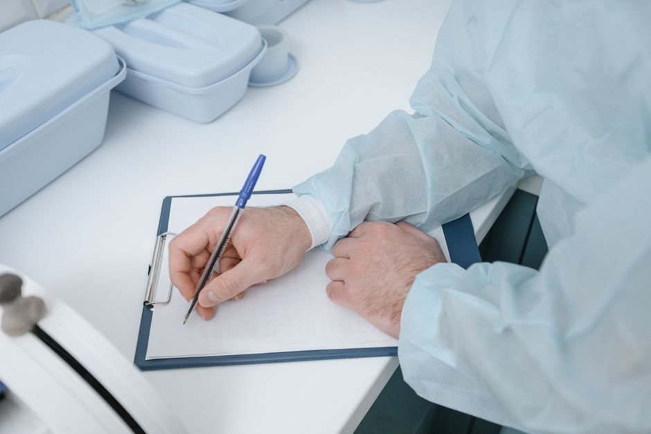 A Navy veteran preparing his VA mesothelioma claim paperwork with help from a benefits advisor